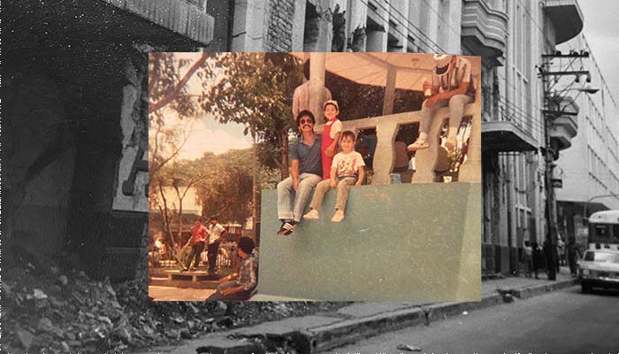 Mauricio sitting, on a stage in city centre of Cojutepeque with four-year-old Mauricio jr stand-in on his right and Bonnie sitting beside him.